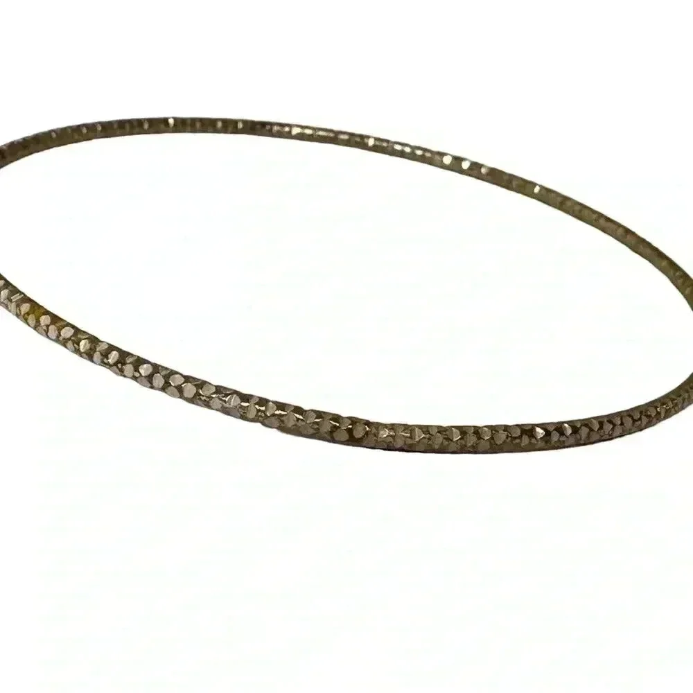 Multiple gold bangle bracelets random assortment of gold colored bracelets